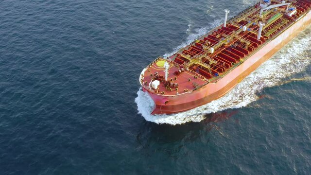 Oil tanker (LPG or chemical) is floating at sea oil port terminal. Oil and gas petrochemical tanker offshore in open sea. Refinery industry cargo ship. Aerial view
