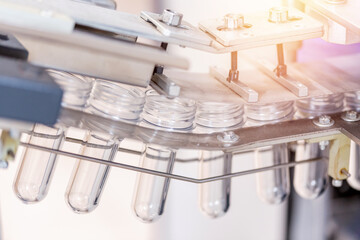 Preforms for making PET plastic bottles. Blank for production of containers for milk or beer. Line factory industry equipment