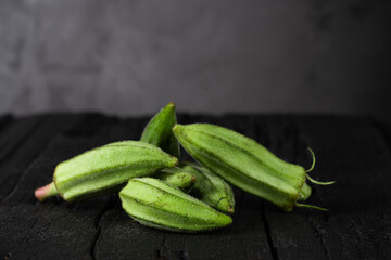 Fresh okra on black background