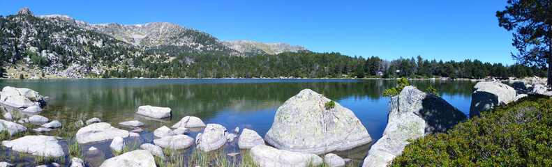 Panoramic view of the Estany de Malniu, a natural lake of glacial origin. Tossa Plana de LLes - Puigpedros, La Cerdanya, Pyrenees, Catalonia.