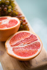 Healthy Organic Red Ruby Grapefruit on wooden background