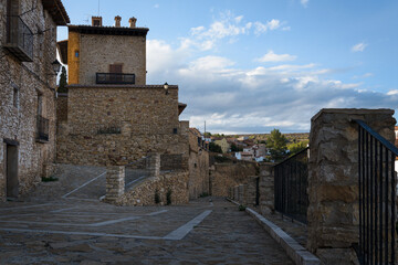 Streets of the medieval village of La Iglesuela del Cid at sunset, Teruel, Spain