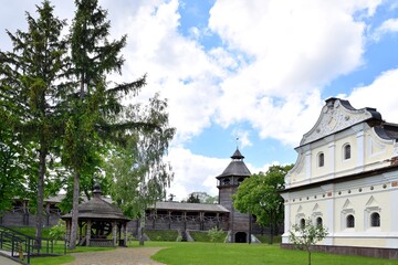 Fototapeta na wymiar The territory of the wooden Cossack fortress with restored historical buildings in Baturin Ukraine. Ukrainian heritage, tourist attractions. Medieval wooden fortress in Chernihiv region near the Seym 