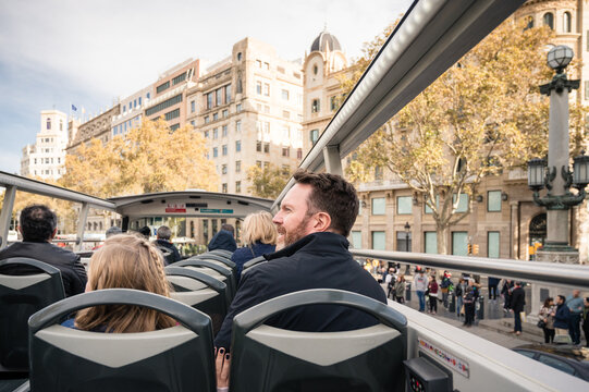 Father And Daughter Riding In Double Decker Tour Bus In Barcelona