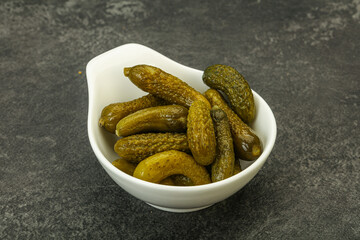 Pickled gherkin in the bowl