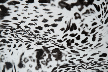 Black and white abstract camouflage. The concealment pattern on a fabric. Concept of winter masking.
