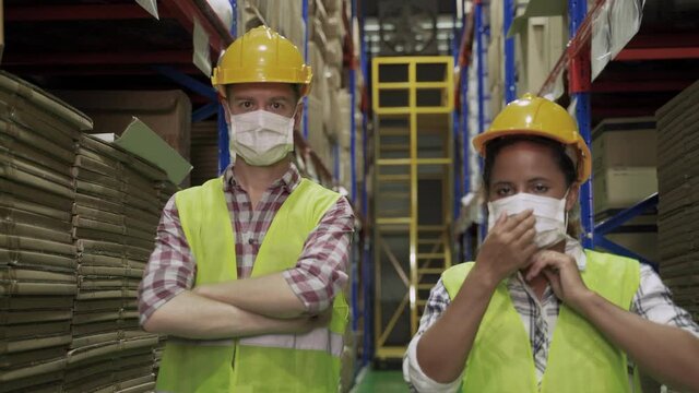 In an epidemic of COVID-19, warehouse workers are wearing masks to prevent the coronavirus outbreak.
