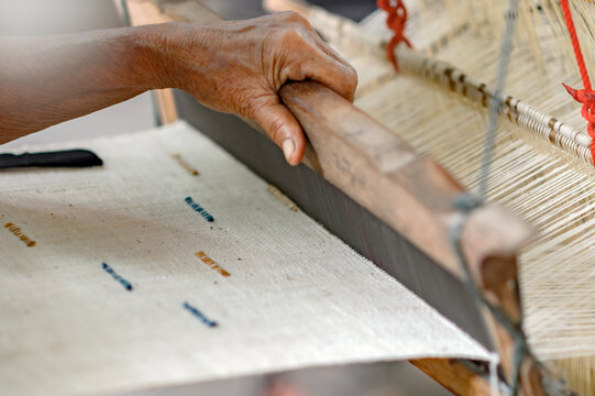 Close up traditional hand weaving before dyeing the indigo fabric of Sakon Nakhon Thailand.