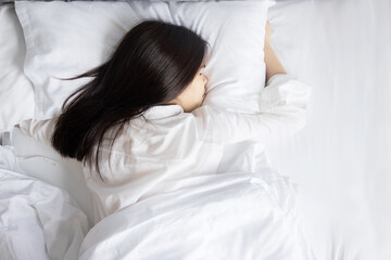 Top Back View of Asian Woman and Sleeping on Her Bed