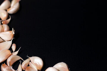 Young garlic cloves are located on the left side of the frame.