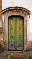 Ancient colonial door at historical city of Ouro Preto, Brazil
