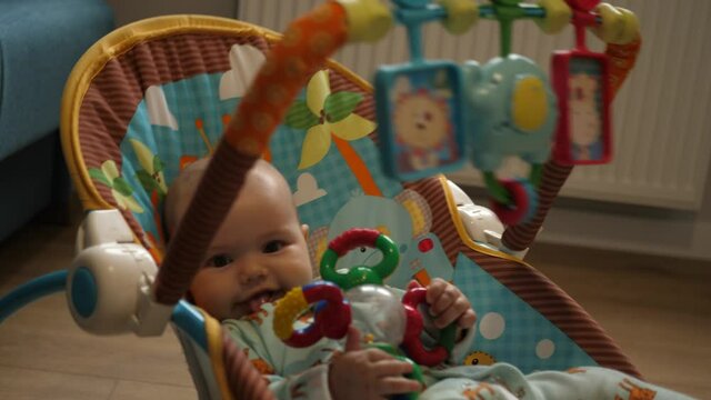 joyful baby little baby swinging in the rocker baby bouncer rocking chair