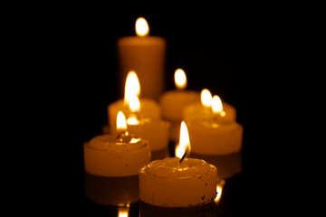 Candles burning at night. Selective focus.