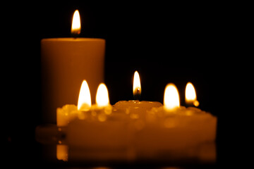 Candles burning at night. Selective focus.