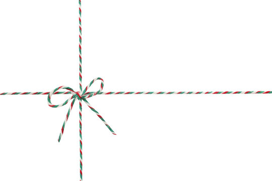 Twine rope with tied  bow isolated in white.Christmas decoration.Braided string for packing.Parcel wrapping tape.