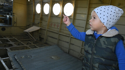 A child inside an abandoned plane