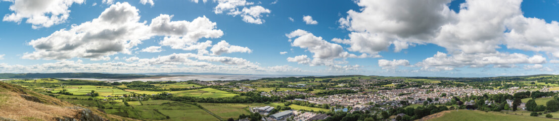 Fototapeta na wymiar Panoramic View from the top of Hoad Hill looking out across the town of Ulverston in Cumbria