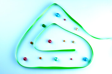 Stylized ribbon green Christmas tree. Christmas tree on a white background. Concept of Christmas time.