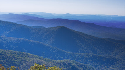 Fototapeta premium The Blue Ridge Mountains appear like waves of an ocean that goes on forever.