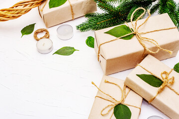 Zero waste gift concept with craft boxes and evergreen branches