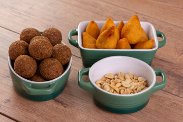 Mix of fried savory snack with coxinha, kebab and roasted and salted peanuts