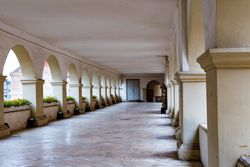Abandoned historical outside corridor with stone arcs
