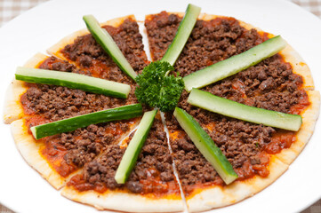 Turkish beef pizza with cucumber on top