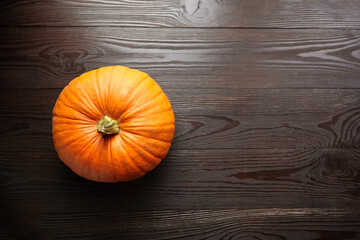 Autumn pumpkin on wooden background