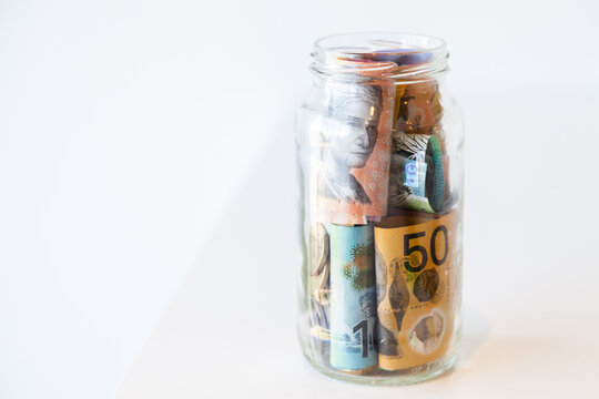 Jar of Australian currency notes and coins