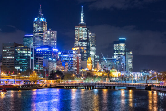 Melbourne City and Yarra River at night with lights shining