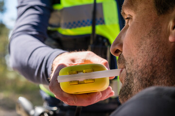 man blowing into RBT unit