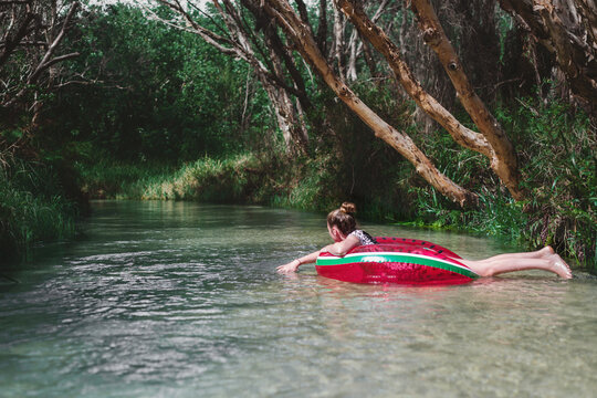 teens floating down Eli Creek,Fraser Island