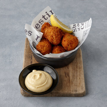 Fried cheese balls on table