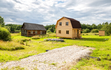 Obraz premium Construction of a new wooden house at the village in summer