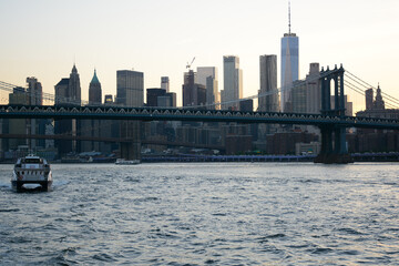 Fototapeta premium New York, NY, USA - June 27, 2019: Manhattan view from the ferry which follows to 34th Street from Brooklyn Bridge Park