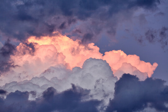 Pink Fluffy Clouds In Sky During Sunset