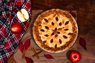 American apple pie flat lay with fall decoration on a table looking delicious