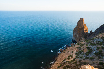 Summer seascape with Fiolent rocks formation on the coast of Sevastopol. view on cape in the sea, clear azure water