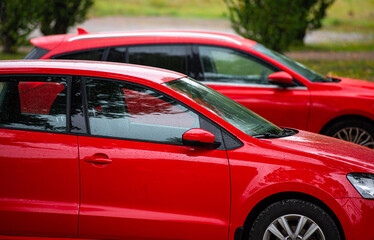 Details of two red cars