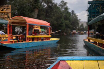 Fototapeta na wymiar Xochimilco boats going by in southern Mexico City, México CDMX