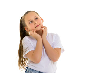 Fototapeta premium The little girl looks up.The concept of children's emotions.