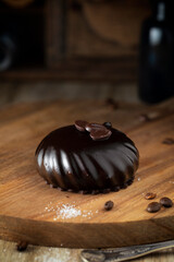 Chocolate muffin on wooden cutting board
