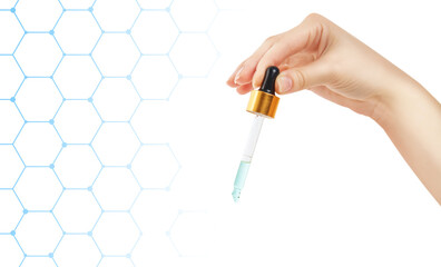 Female hand holds glass dropper. Over white background with hexagon lines.
