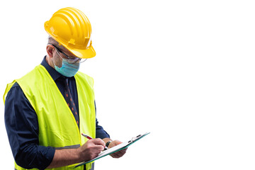 Engineer isolated on white background wears surgical mask to prevent Coronavirus spread, holds pen and notebook in hand. Preventing Pandemic Covid-19 at the workplace.