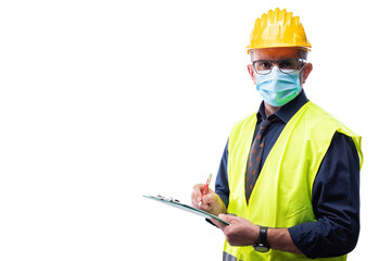 Engineer isolated on white background wears surgical mask to prevent Coronavirus spread, holds pen and notebook in hand. Preventing Pandemic Covid-19 at the workplace.