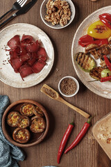 dishes and snacks of traditional Caucasian Georgian cuisine. classic national serving on a rustic wooden table