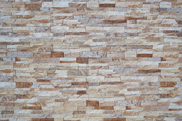 Obraz premium Ceramic tiles that mimic a horizontal fine stone wall with vivid colors, ideal textures and backgrounds