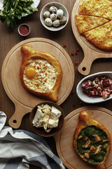 dishes and snacks of traditional Caucasian Georgian cuisine. classic national serving on a rustic wooden table