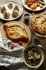 dishes and snacks of traditional Caucasian Georgian cuisine. classic national serving on a rustic wooden table
