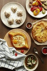 dishes and snacks of traditional Caucasian Georgian cuisine. classic national serving on a rustic wooden table